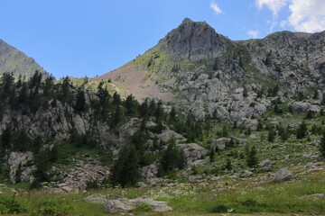 Jaw-droppingly beautiful mountains and lakes in Sant'Anna di Vinadio on a partly cloudy day.