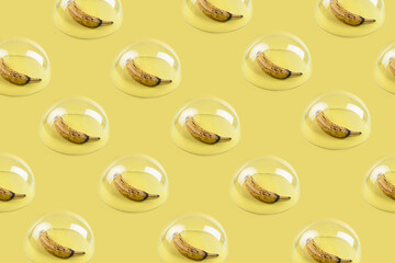 Pattern made of bananas under the glass dome. Minimal pop art concept. Flat lay.