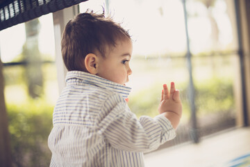 boy looking out the window 