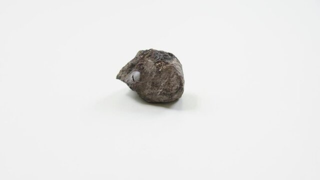 detail of hematite with pyrite over white background