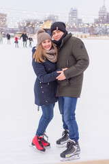 Fototapeta na wymiar young couple having fun in winter