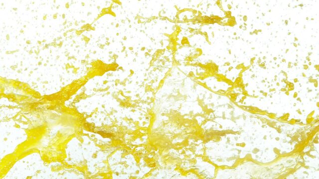 Super slow motion of orange splashes on white background. Filmed on high speed cinema camera, 1000 fps.