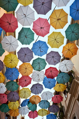 colorful umbrellas adorn the streets