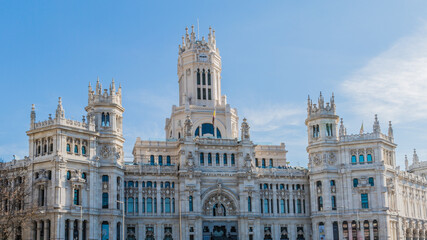 Fototapeta na wymiar Exterior facade of the post office building in Plaza Cibeles in Madrid Spain on sunny day with a blue sky