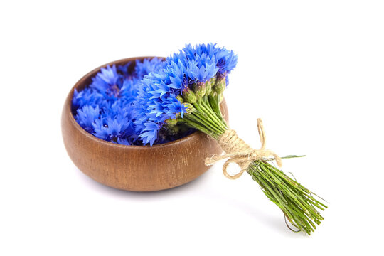 Cornflowers bouquet with bowl isolated on white background