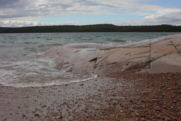 landscape of a rock in front of a beach