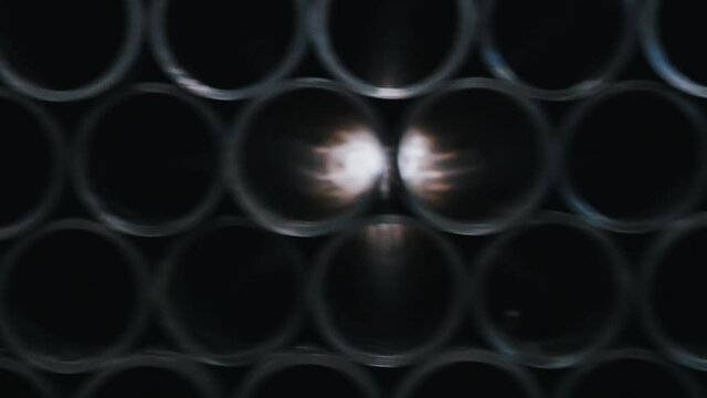 Bright light comes through the black plastic tubes on factory