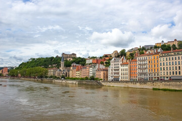 Fototapeta na wymiar Lion, France - View from river Sona to the bridge and Lyon city
