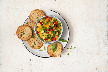 Fresh salad with mango, red pepper, avocado and mint
