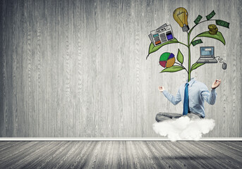 Headless businessman meditating