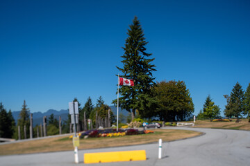 A picture of a Canadian flag  taken with tilt-shift effect.  Burnaby BC Canada 
