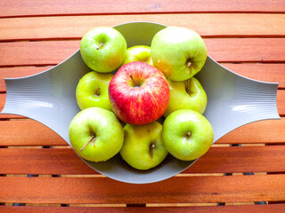 Apples on a wooden table.