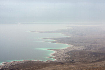 Twisting Dead Sea coastline in the fog.