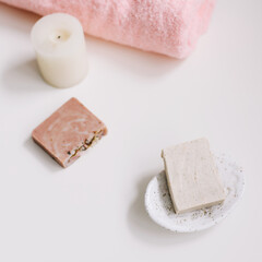 Spa set. Bar of handmade soap, candle and towel. Accessories for personal hygiene. Decor for bathroom interior