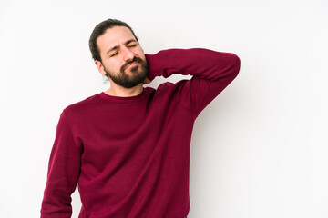 Fototapeta premium Young long hair man isolated on a white background touching back of head, thinking and making a choice.