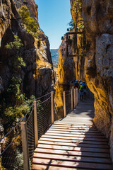 Fototapeta na wymiar Wooden path on the cliff that runs through the entire Gaitanes gorge
