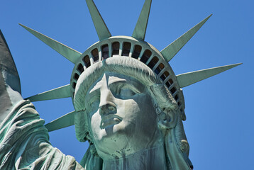 New York, USA, April 22, 2020: Statue of Liberty in New York close up. Blue sky in Manhattan