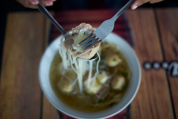 Meatballs with Noodle Soup on table at street food market