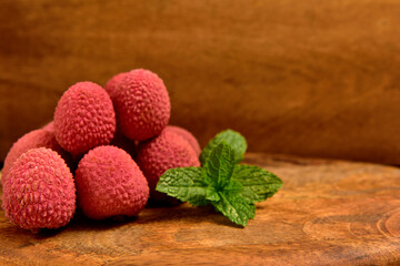 Colorful Natural organic Lychees on a wooden board