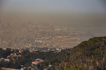 Fototapeta premium Smog dome and dust during sunrise in a very polluted city. Panoramic View of Beirut (Lebanon).