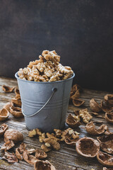 Small bowl full of peeled walnuts.