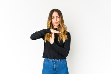 Young caucasian woman isolated on white background showing a timeout gesture.