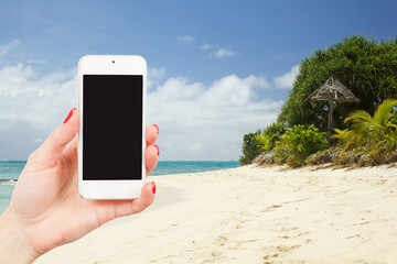 Woman holding smartphone isolated beauty landscape beach background