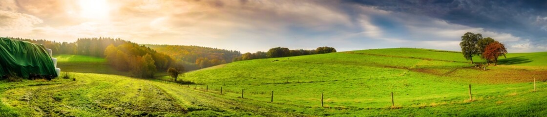 Panorama of an autumn landscape in the light of the morning sun