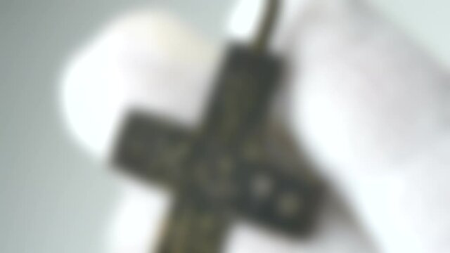 Blurred background. ancient cross archaeological find White background
