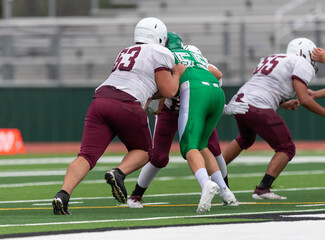 Naklejka premium Amazing athletes making great catches and runs during a competitive football game