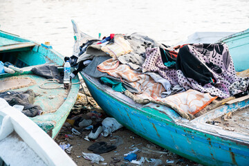 Pile of clothing and junk on a fishing boat