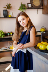 girl stands in the dining room