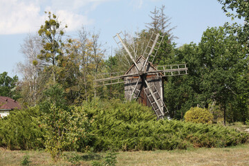 Rural summer landscape with an old mill.