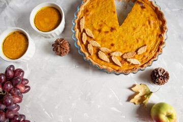 Thanksgiving Day celebration. Traditional pie. The pie lies on a gray background. Thanksgiving Day celebration concept. space for text