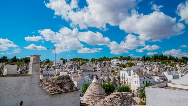 Timelapse view of the traditional trulli houses in Arbelobello, province Bari, region Puglia, Italy. Beautiful old town of Arbelobello with small white houses.