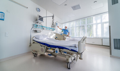 Modern chamber in present clinic. Medical bed and a special device in the modern ward. Special...