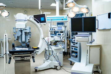 Equipment and medical devices in modern operating room. Operating theatre. Selective focus.