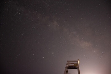 starry night sky, lifeguards tower, beach