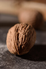 Walnut closeup on a dark background. Selective focus