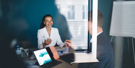 Successful businesswoman discussing ideas with colleague