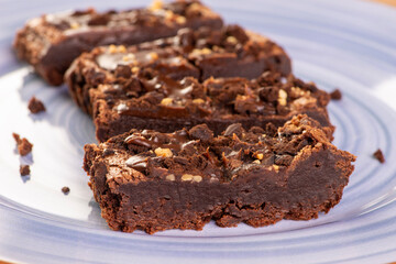 some brownie slices on a blue plate