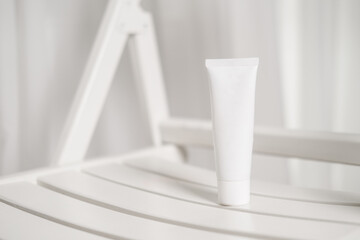 White cosmetic tube on white background, beauty product, brand package mockup