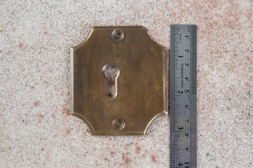 Antique brass key hole cover