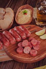 Grilled Sausage skewer on wooden board - Brazilian barbecue