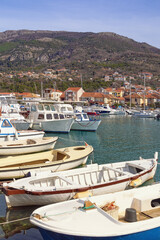 Fototapeta na wymiar Winter Mediterranean landscape. Fishing boats in harbor. Montenegro, Tivat city, view of marina Kalimanj