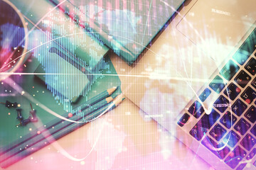 Business theme hologram drawings over computer on the desktop background. Top view. Multi exposure. Concept of international connections.