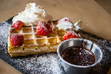 Belgium waffles with hot chocolate and berries