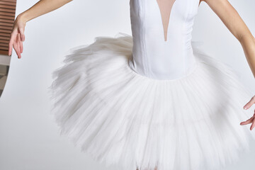 Fototapeta premium ballerina white tutu dance exercise performance light background