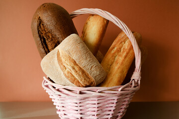 Bread basket. Assorted bakery products in wicker basket.