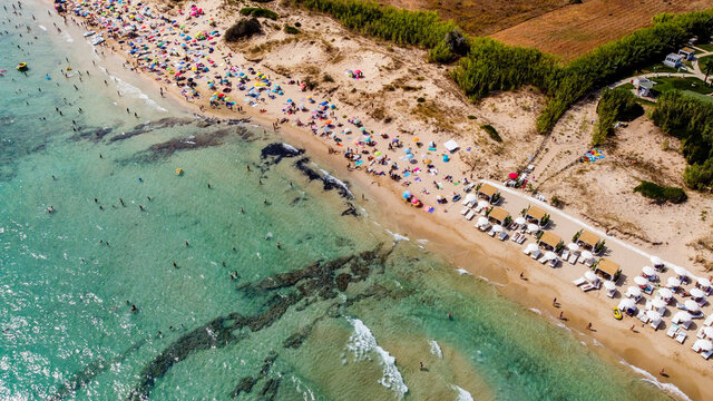 Aerial view of the Pescoluse Beach, aka Maldives of Salento, in the south of Italy - Apulian beach with turquoise waters in summer - Idyllic holiday destination along the Ionian Sea